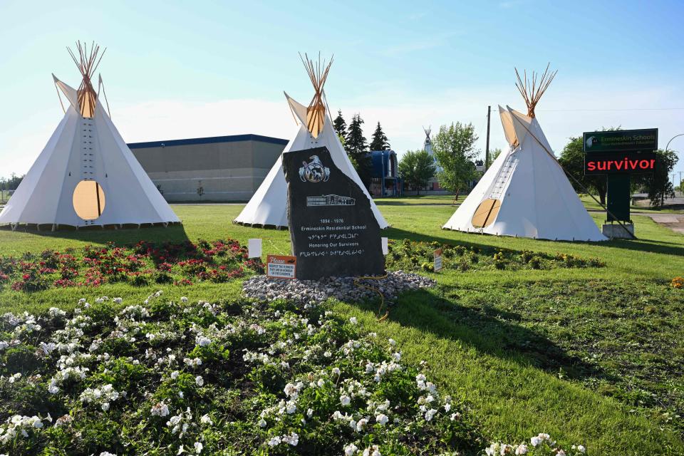 A monument honoring the survivors of the Ermineskin Indian Residential School displayed near the site of the school in Maskwacis, Alberta, on July 23, 2022, ahead of Pope Francis' visit to Canada. The pope is expected to offer an apology to Indigenous peoples for more than a century of abuses at state schools run by the church in Canada.