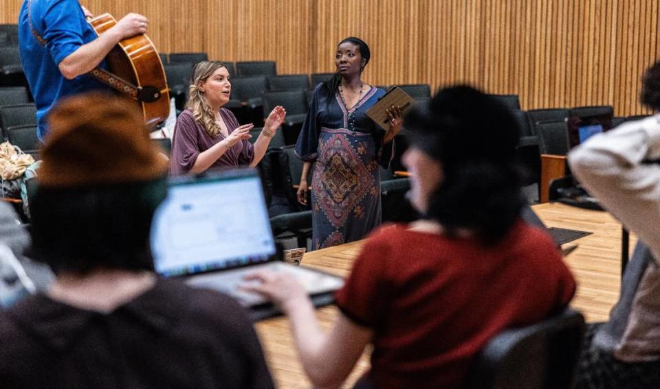 UNC Charlotte professors Laura Waringer, back left, and Sequina DuBose lead rehearsal for “Threads” at the university’s Rowe Recital hall. The production is part of a musical theater workshop they teach.