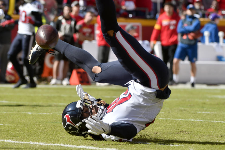 Houston Texans wide receiver Will Fuller V cannot hold onto the ball during the first half of an NFL football game against the Kansas City Chiefs in Kansas City, Mo., Sunday, Oct. 13, 2019. (AP Photo/Ed Zurga)