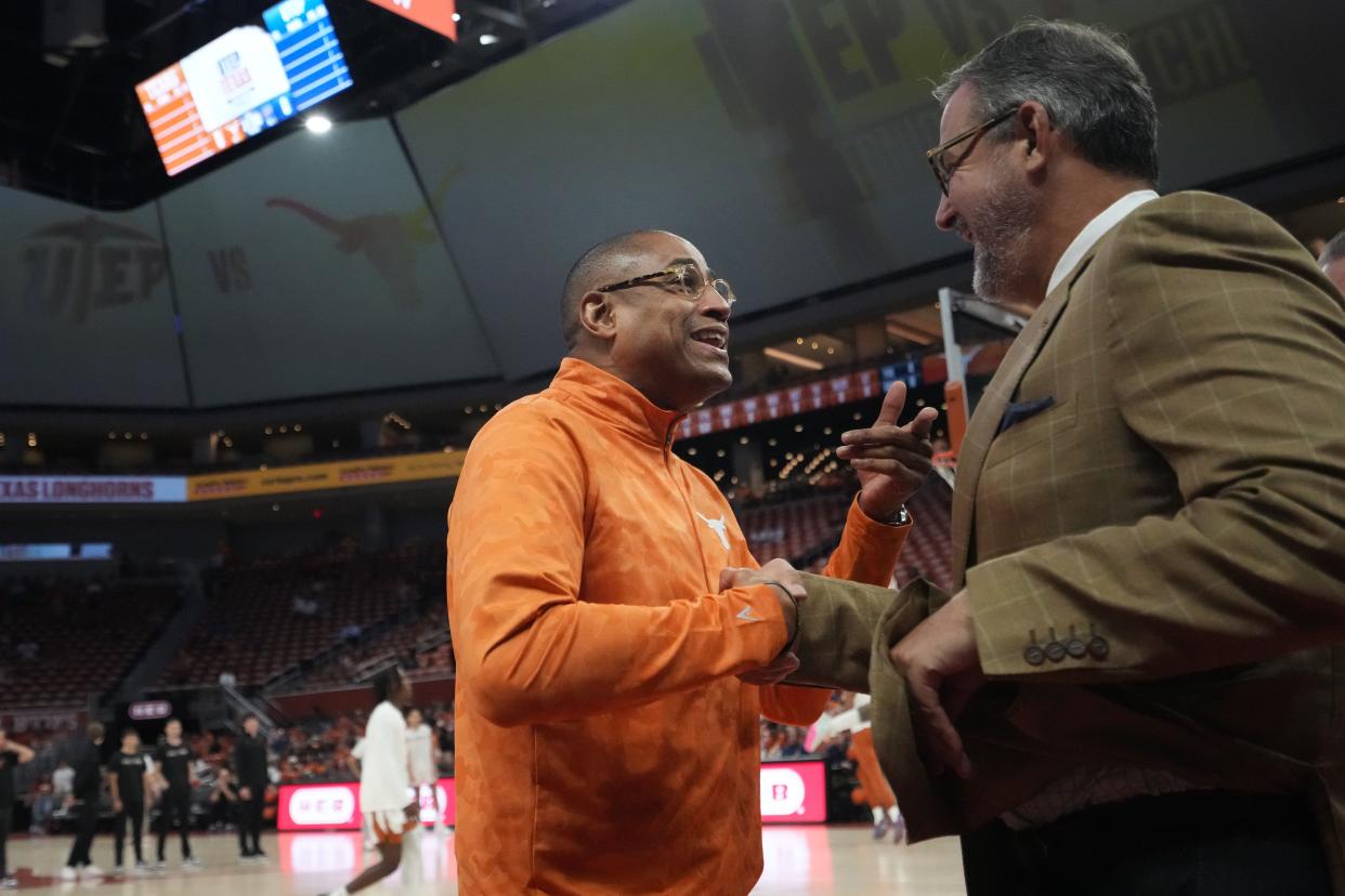 Texas Longhorns assistant head coach Rodney Terry, former UTEP Miner head coach, speaks with University of Texas Athletic Director Chris Del Conte at the game Monday, Nov. 7, 2022, at the Moody Center in Austin.