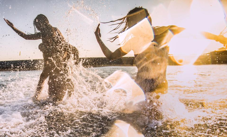 carefree friends having fun during their summer vacation in the sea