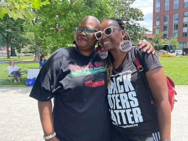 Melanie Campbell, left, president of the National Coalition on Black Civic Participation, and Stephanie Williams, head of the Black Women's Roundtable chapter in Kalamazoo, Mich., join a Black Voters Matter rally June 25 in Richmond, Va.