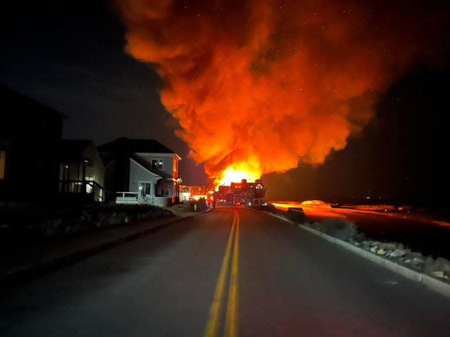 Several homes were on fire in the Minot Beach neighborhood of Scituate Friday, March 24, 2023.