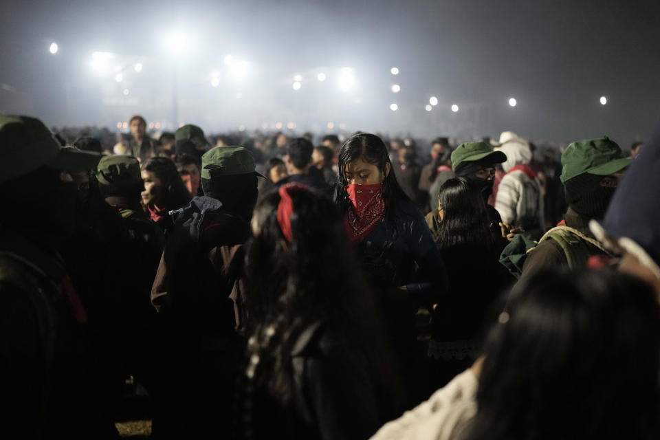 Members of the Zapatista National Liberation Army, EZLN, dance during an event marking the 30th anniversary of the Zapatista uprising in Dolores Hidalgo, Chiapas, Mexico, early Monday, Jan. 1, 2024. (AP Photo/Eduardo Verdugo)