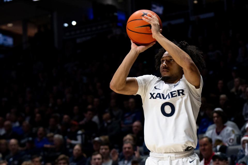 Xavier Musketeers guard Trey Green (0) hits a 3-point basket in the second half of the basketball game between Xavier Musketeers and Seton Hall Pirates at the Cintas Center in Cincinnati on Saturday, Dec. 23, 2023.