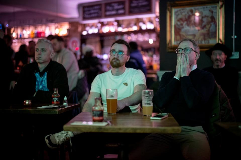 People react to tonight’s match at The Village pub in London (EPA)