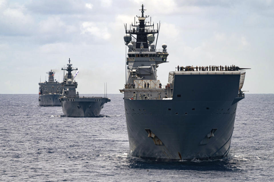 In this photo undated photo provided by the Australian Defense Force, Royal Australian Navy Ships Canberra, Supply and Warramunga sail in formation with 37 ships during Exercise Rim of the Pacific 2022. The Australian government on Monday, April 24, 2023, released a review of the nation's defense strategy that recommends a major overhaul of the armed forces including a focus on developing an ability to strike targets at a longer range as China's military build-up challenges the region's security. (Petty Officer 2nd Class Wesley Richardson/Australian Defense Force via AP)