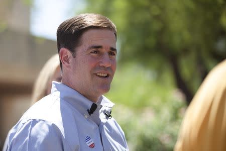 Arizona Republican gubernatorial primary candidate Doug Ducey smiles after voting in the Paradise Valley section of Phoenix, Arizona August 26, 2014. REUTERS/Samantha Sais