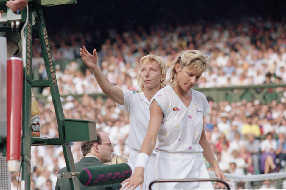 FILE - In this June 30, 1988, file photo, defending champion Martina Navratilova reaches to shake hands with the umpire as a dejected Chris Evert walks off court after their women's singles semifinal match on the Centre Court at Wimbledon. Navratilova won the match 6-1, 4-6, 7-5. (AP Photo/Robert Dear, File)