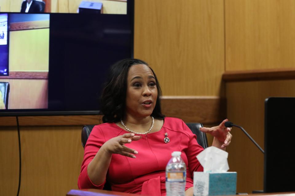 ATLANTA, GA - FEBRUARY 15: Fulton County District Attorney Fani Willis testifies during a hearing in the case of the State of Georgia v. Donald John Trump at the Fulton County Courthouse on February 15, 2024 in Atlanta, Georgia. Judge Scott McAfee is hearing testimony as to whether Willis and Special Prosecutor Nathan Wade should be disqualified from the case for allegedly lying about a personal relationship. (Photo by Alyssa Pointer-Pool/Getty Images)