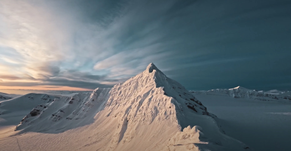 One of many stunning peaks that rise from the frozen tundra of Svarlbard.<p><a href="https://www.youtube.com/@LifeofTao" rel="nofollow noopener" target="_blank" data-ylk="slk:YouTube/Tao Kreibich;elm:context_link;itc:0;sec:content-canvas" class="link ">YouTube/Tao Kreibich</a></p>