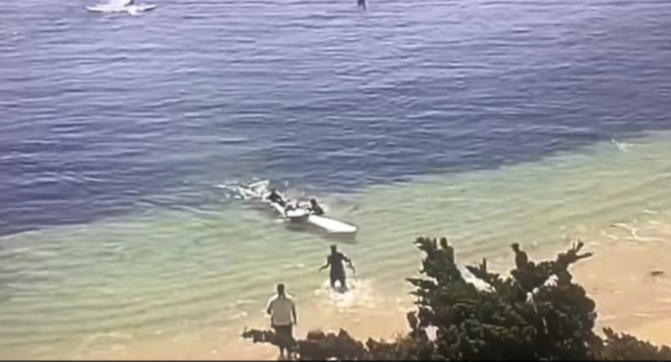 Steve Bruemmer is brought into shore after being attacked by a shark (Facebook)