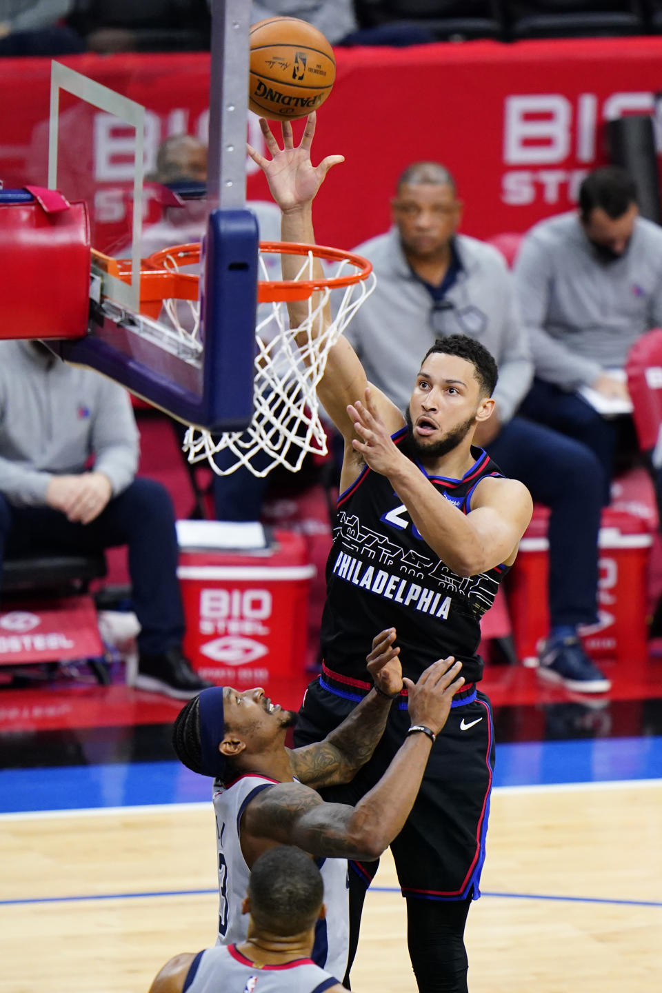 Philadelphia 76ers' Ben Simmons, right, goes up for a shot against Washington Wizards' Bradley Beal during the first half of Game 2 in a first-round NBA basketball playoff series, Wednesday, May 26, 2021, in Philadelphia. Ben Simmons can't shoot and lost his confidence. He blamed a mental block on the worst free-throw shooting percentage in NBA playoff history. The 76ers head into the offseason faced with a big question - do they try and salvage Simmons or deal the former No. 1 pick. (AP Photo/Matt Slocum)