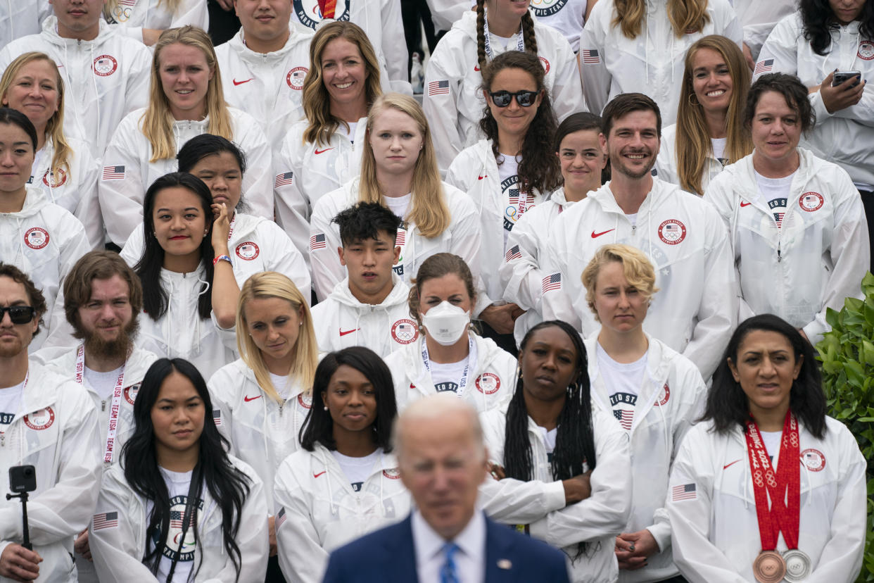 Members of Team USA listen as President Joe Biden speaks during an event with the Tokyo 2020 Summer Olympic and Paralympic Games, and Beijing 2022 Winter Olympic and Paralympic Games, on the South Lawn of the White House, Wednesday, May 4, 2022, in Washington. (AP Photo/Evan Vucci)