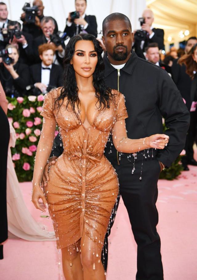 Kim Kardashian Out in Super Low-Cut Versace Gown for Met Gala