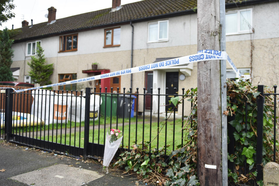 A floral tribute outside the house in Widnes (Caters)