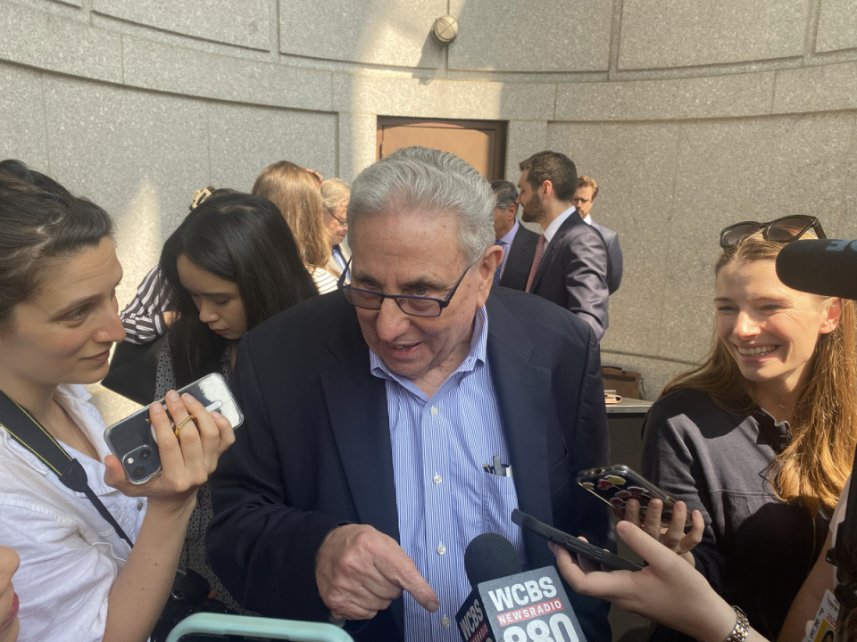 New York real estate titan Jeffrey Gural talks to reporters after successfully bidding $161m for the Flatiron Building at auction in New York on Tuesday (Bevan Hurley / The Independent)