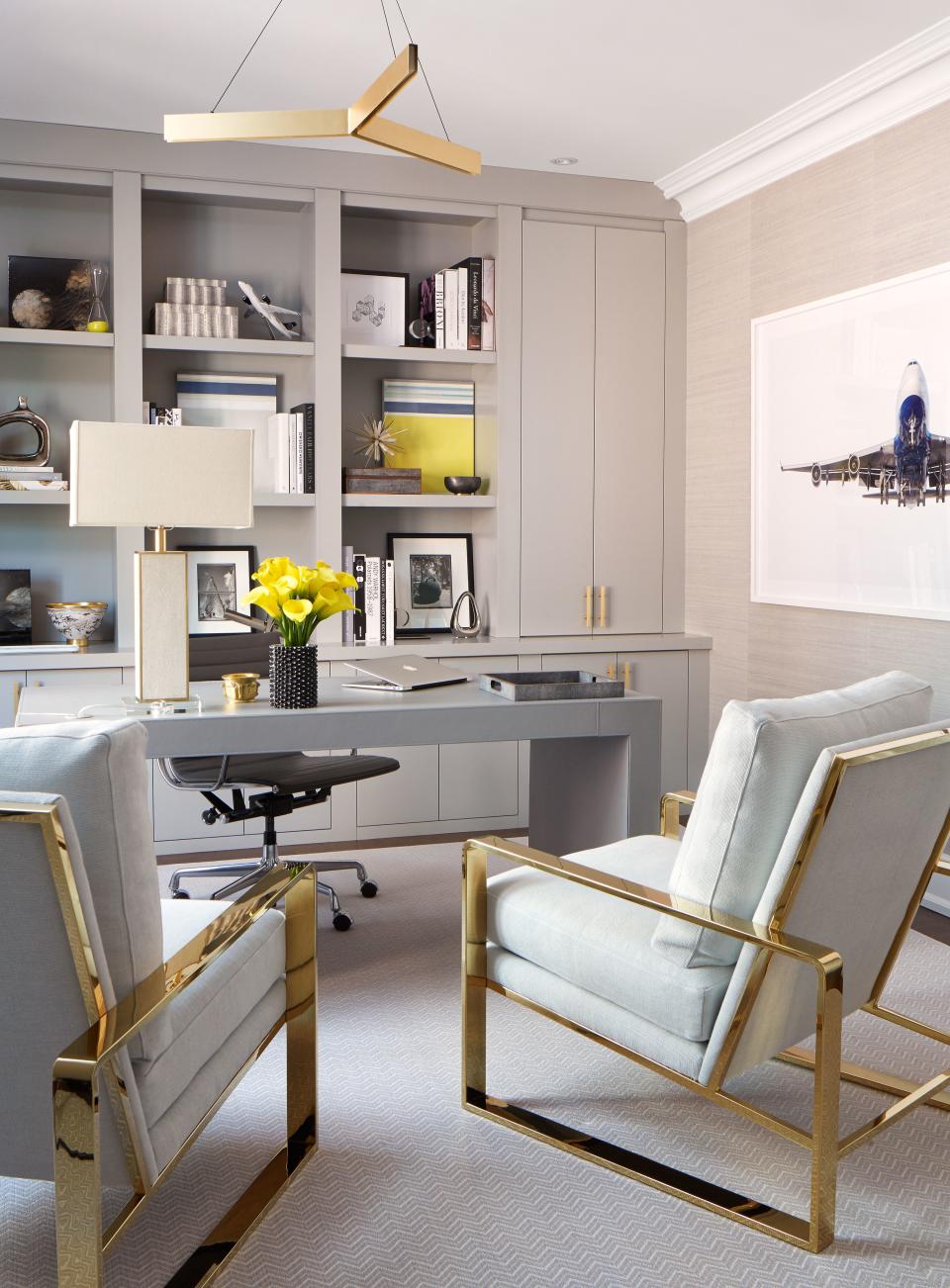 The study is packed with luxe details, including a gray leather hand-stitched desk and a pair of suede-and-brass club chairs.