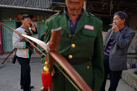 Ethnic Lisu men attend a crossbow shooting competition in Luzhang township of Nujiang Lisu Autonomous Prefecture in Yunnan province, China, March 29, 2018. REUTERS/Aly Song