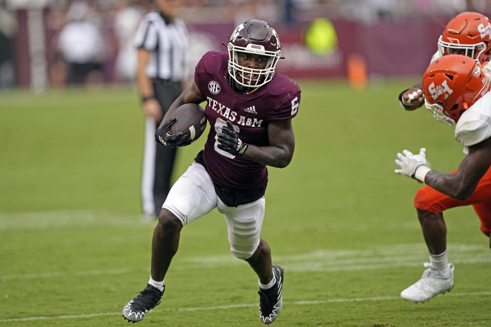 Texas A&M running back Devon Achane (6) runs for a first down during the second half of an NCAA college football game against Sam Houston State Saturday, Sept. 3, 2022, in College Station, Texas. (AP Photo/David J. Phillip)