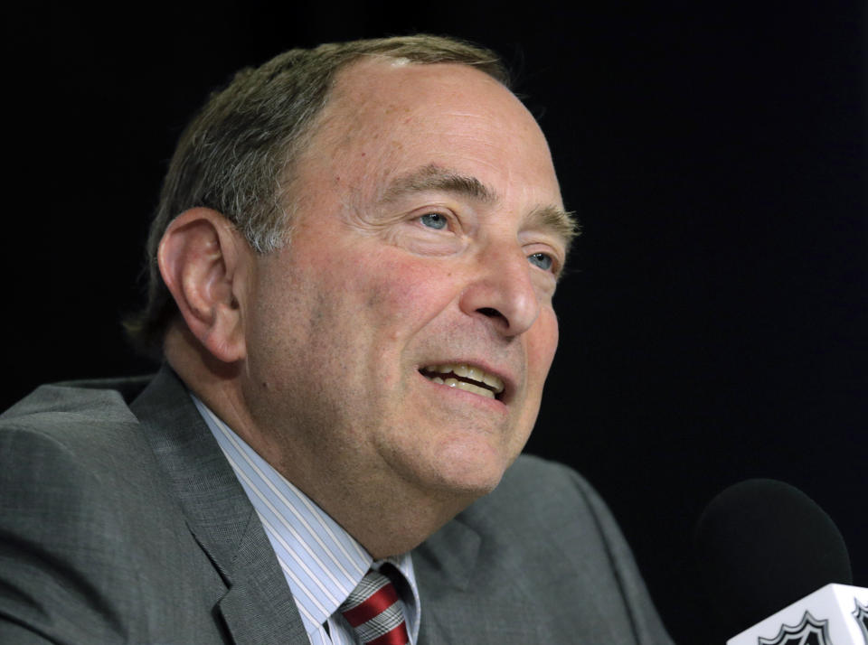 FILE - In this June 6, 2019, file photo, NHL Commissioner Gary Bettman speaks during a news conference before Game 5 of the NHL hockey Stanley Cup Final between the St. Louis Blues and the Boston Bruins in Boston. Under the terms of the collective bargaining agreement, NHL owners and players divide hockey-related revenue 50/50, and if player salaries exceed that split a certain percentage is withheld in escrow to make it even. The Chicago Blackhawks captain Jonathan Toews and fellow players have lost upwards of 10% of their pay to escrow over the past seven seasons, which is why 25 of 31 NHL Players’ Association representatives surveyed by The Associated Press and Canadian Press named escrow as the biggest bargaining issue with September deadlines looming to terminate the current CBA effective the fall of 2020. (AP Photo/Charles Krupa, File)