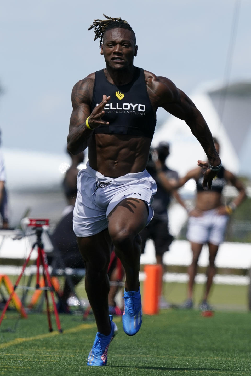 Iowa wide receiver Brandon Smith competes in the 40-yard dash during an NFL football mini combine organized by House of Athlete, Friday, March 5, 2021, in Fort Lauderdale, Fla. (AP Photo/Marta Lavandier)