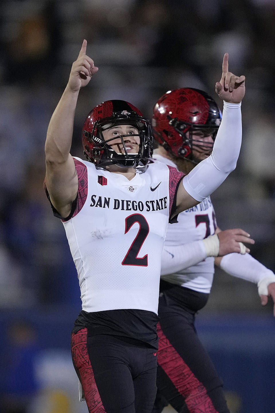 FILE - San Diego State's Matt Araiza (2) celebrates his field goal against San Jose State during the first half of an NCAA college football game Friday, Oct. 15, 2021, in San Jose, Calif. Araiza is unquestionably the best player for the No. 19 Aztecs, who will host Utah State in the Mountain West Conference championship game Saturday, Dec. 4, 2021, at their temporary home in Carson, a Los Angeles suburb. Using his powerful left leg, the junior from San Diego is able to completely flip the field for SDSU, which has a strong defense but often struggles on offense. (AP Photo/Tony Avelar, File)
