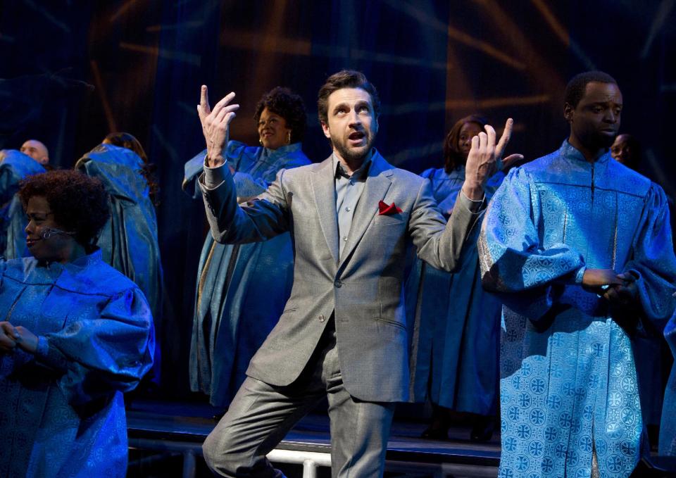 In this theater image released by Boneau/Bryan-Brown, Raul Esparza is shown during a performance of "Leap of Faith," at the St. James Theatre in New York. (AP Photo/Boneau/Bryan-Brown, Joan Marcus)