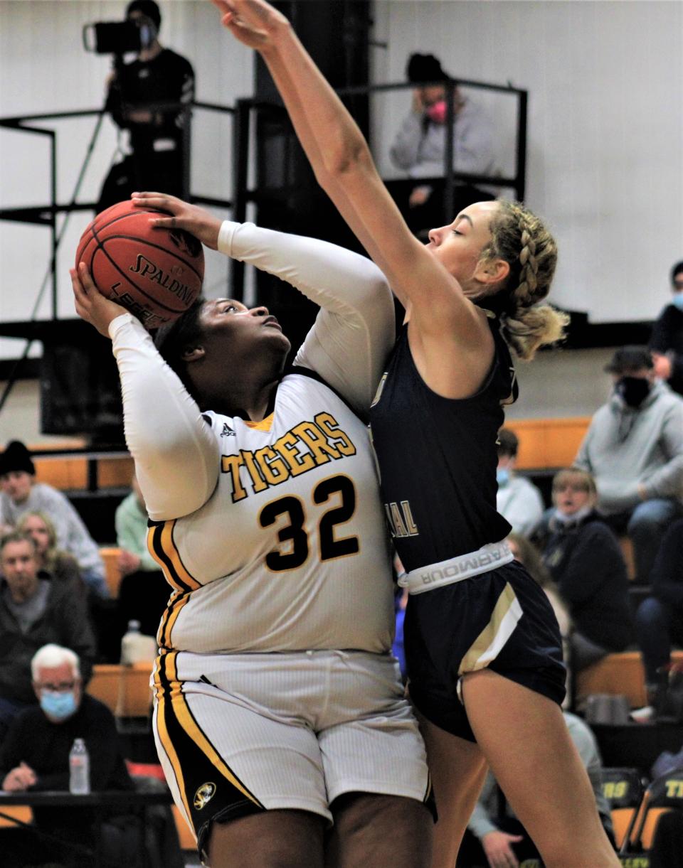 Bellevue senior Deja Joseph tries to shoot over Lloyd Memorial senior Jalyn Ballman as Lloyd Memorial defeated Bellevue 54-34 during the Stephanie Wilson Memorial basketball tournament Dec. 28, 2021.