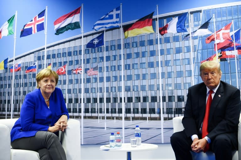 Relations between US President Donald Trump (R) and German Chancellor Angela Merkel have been strained at the NATO summit