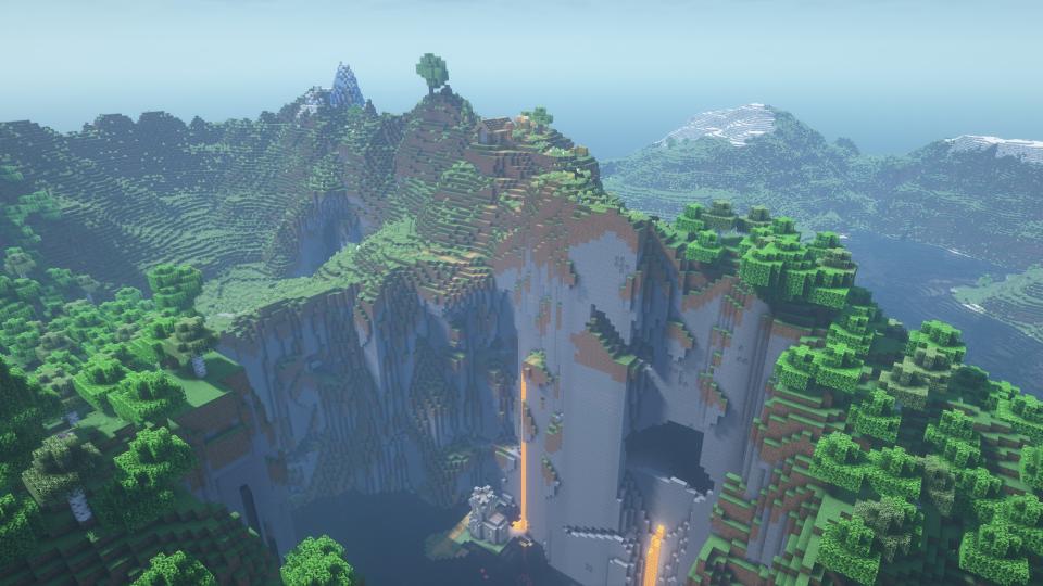 Minecraft seeds - A sheer stone ridge with a house at the top and a church in a ravine below.