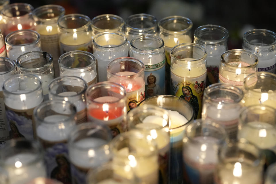 Candles lit by devotees feature images of the Virgin of Guadalupe, during a festival celebrating one of several apparitions of the Virgin Mary witnessed by an indigenous Mexican man named Juan Diego in 1531, at St. Ann Mission in Naranja, Fla., Sunday, Dec. 10, 2023. For this mission church where Miami's urban sprawl fades into farmland and the Everglades swampy wilderness, it's the most important event of the year, both culturally and to fundraise to continue to minister to the migrant farmworkers it was founded to serve in 1961. (AP Photo/Rebecca Blackwell)