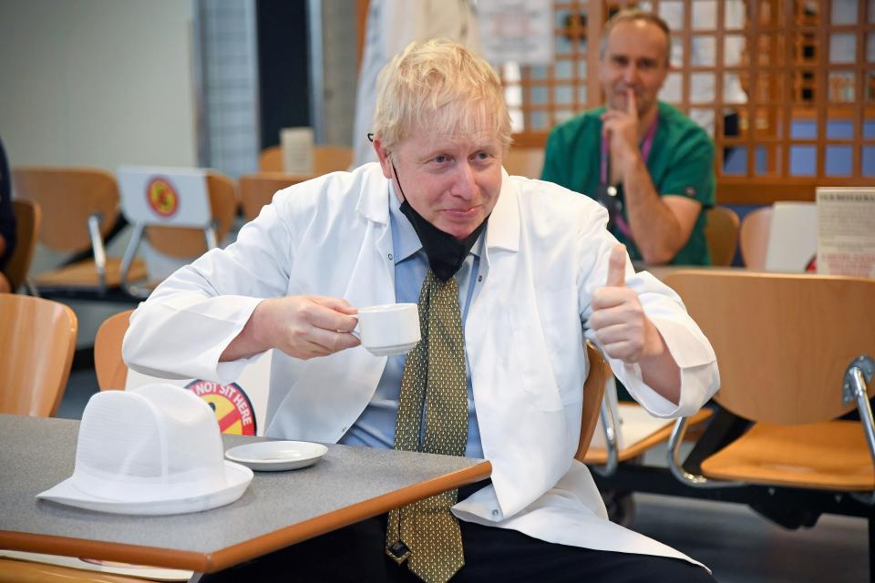 Boris Johnson visits a hospital canteen in Reading to promote a new report on hospital food (POOL/AFP via Getty Images)