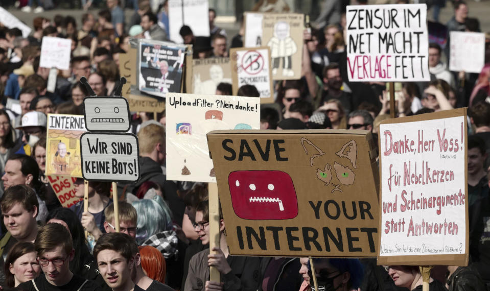 People protest against the Directive on Copyright in the Digital Single Market by the European Union in Leipzig, Germany, Saturday, March 23, 2019. People fear for the freedom of the internet when users content has to pass upload filters to protect copyrights. (Peter Endig/dpa via AP)