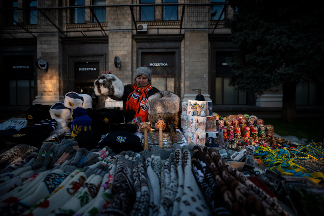 A street vendor arranges her stall with various items, among them a toilet paper with Russian president Putin's portrait on October 30, 2019. (Photo: Agron Dragaj for Yahoo News)