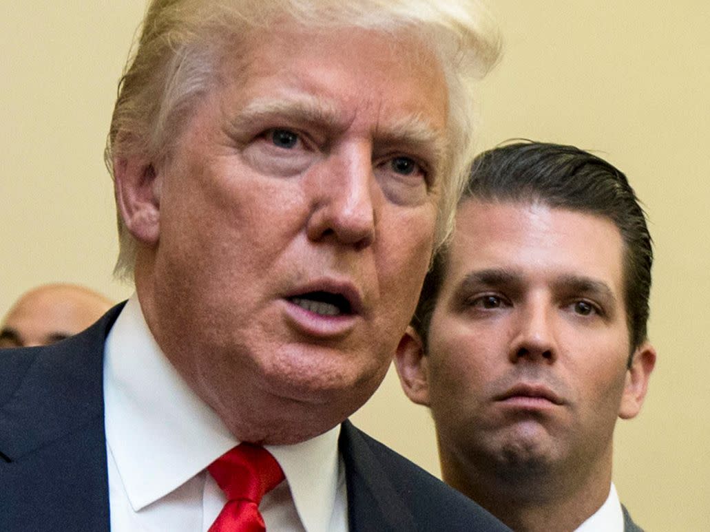 Donald Trump (left) and Donald Trump Jr. (right) are pictured during the unveiling of the design for the Trump International Hotel in The Old Post Office in Washington,  D.C. on Sept. 10, 2013. 