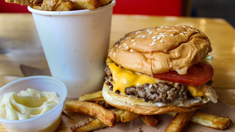 burger with fries and sauce