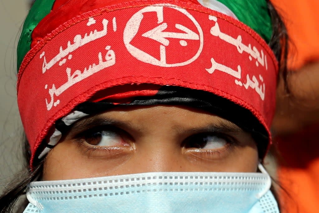 A girl wearing a headband of the Popular Front for the Liberation of Palestine  (REUTERS)