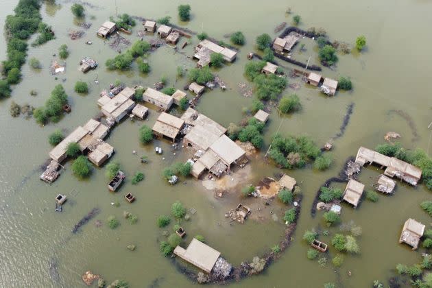 This aerial view shows a flooded residential area in Dera Allah Yar town after heavy monsoon rains in Jaffarabad district. (Photo: FIDA HUSSAIN via Getty Images)