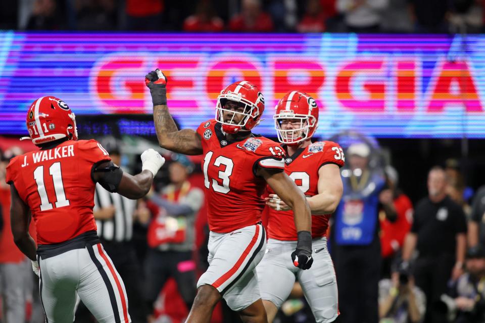 Georgia defensive lineman Mykel Williams (13) reacts after a play against Ohio State during the first half of the 2022 Peach Bowl at Mercedes-Benz Stadium.