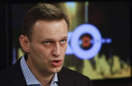 FILE PHOTO: Russian opposition leader Alexei Navalny speaks in the studio of the radio station Echo of Moscow in Moscow, Russia December 27, 2017. REUTERS/Sergei Karpukhin