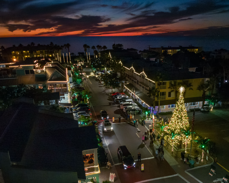 Bridge Street in Bradenton Beach on Anna Maria Island features a Christmas tree and holiday lights.