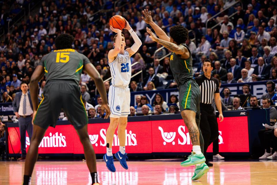 Brigham Young Cougars guard Spencer Johnson (20) shoots a 3-point basket during a men’s college basketball game between Brigham Young University and Baylor University at the Marriott Center in Provo on Tuesday, Feb. 20, 2024. | Megan Nielsen, Deseret News