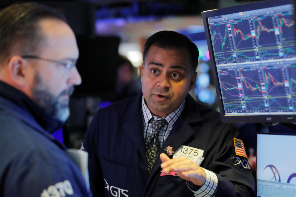 Traders work on the floor of the New York Stock Exchange shortly after the opening bell in New York, U.S., December 3, 2019.  REUTERS/Lucas Jackson