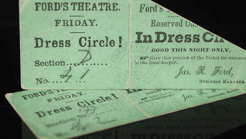 In this photo provided by Boston-based RR Auction house, rare front-row balcony tickets to Ford’s Theatre on April 14, 1865, rest on a reflective surface. The tickets, dated when President Abraham Lincoln was assassinated by John Wilkes Booth, were sold at auction for $262,500 on Saturday, Sept. 23, 2023, according to RR Auction.