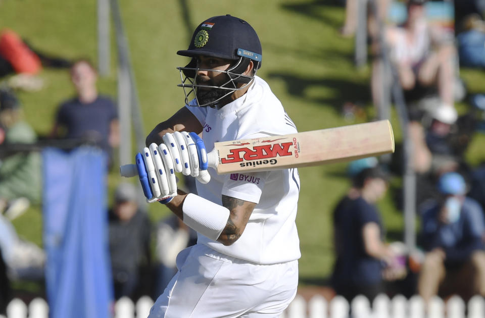 India's Virat Kohli sweeps around to be caught off the bowling of New Zealand's Trent Boult for 19 during the first cricket test between India and New Zealand at the Basin Reserve in Wellington, New Zealand, Sunday, Feb. 23, 2020. (AP Photo/Ross Setford)