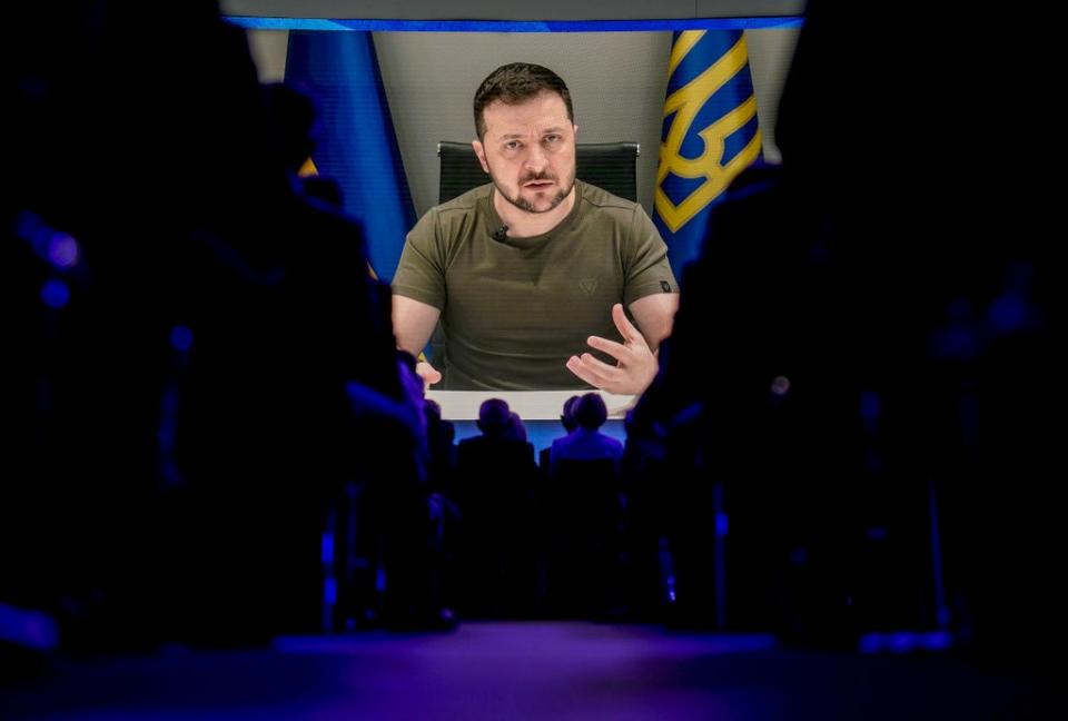 Zelensky addresses the Davos summit on video link from Kyiv (AP)