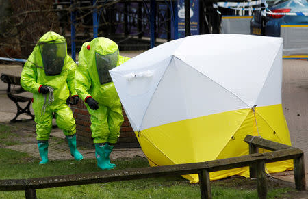 The forensic tent, covering the bench where Sergei Skripal and his daughter Yulia were found, is repositioned by officials in protective suits in the centre of Salisbury, Britain, March 8, 2018. REUTERS/Peter Nicholls TPX IMAGES OF THE DAY