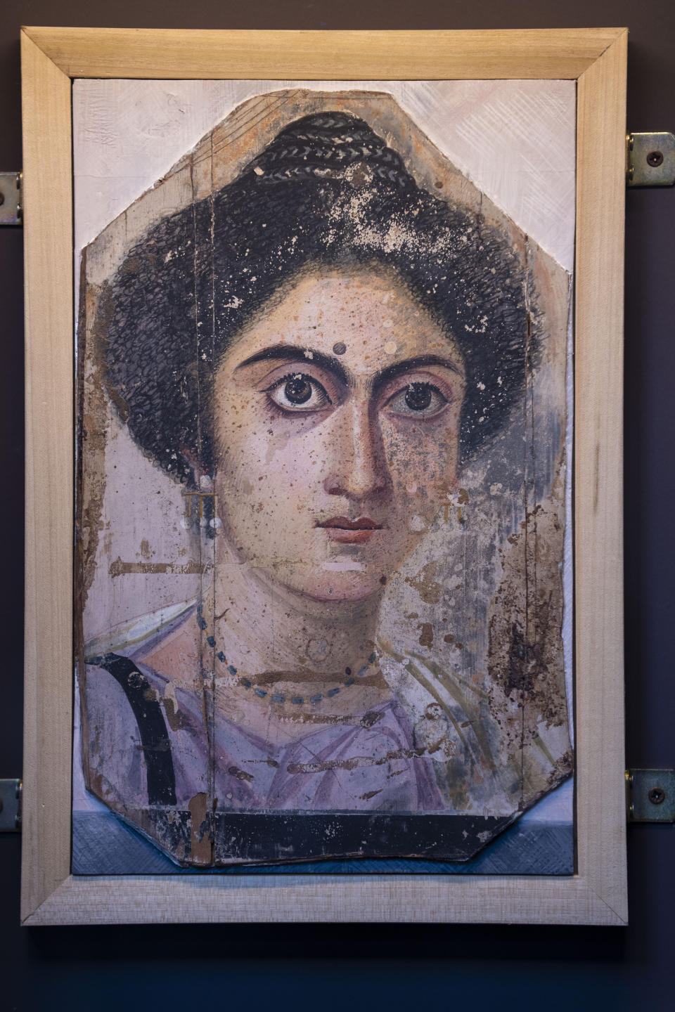 CORRECTS THE EXHIBITION CLOSING DATE - The burial portrait of a woman, 2nd century AD, is on display at the exhibition 'Between us and the ancients. The instant and eternity' in Rome's Diocletian Baths, Wednesday, May 3, 2023. The exhibition will open to the public from May 4 through July 30, 2023. (AP Photo/Domenico Stinellis)