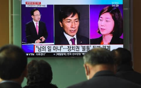Ahn Hee-jung shown on TV alongside a former secretary Kim Ji-eun who accused him of multiple rapes - Credit: Getty